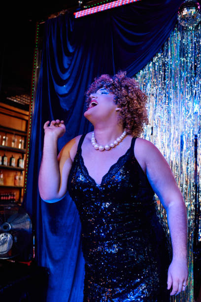 istock Vibrant drag queen captivates audience at a festive holiday performance on stage 2187099146