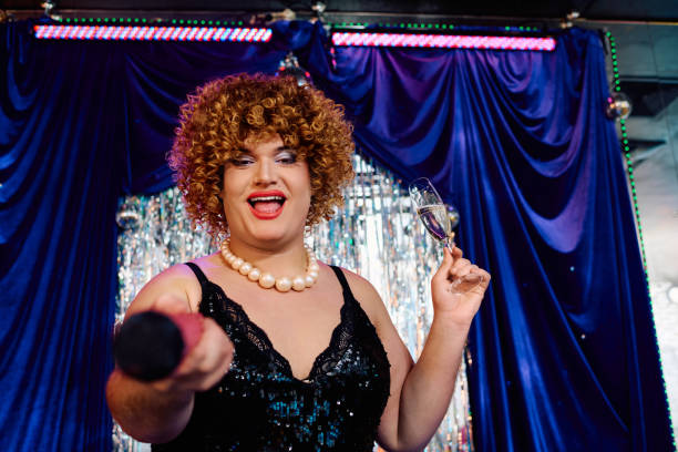 istock Vibrant drag queen shines on stage during a festive holiday performance 2187099227