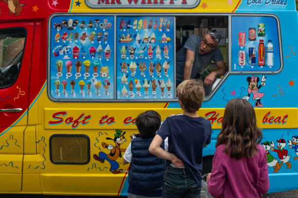 An ice cream van in Queens Park, London, United Kingdom. ice cream vans are a joy for kids and a family tradition in UK.