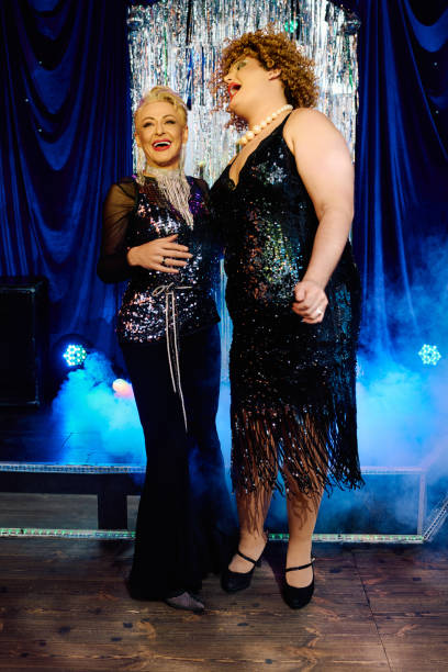 istock Bold drag queens shining together during an extravagant holiday performance on stage 2187099537