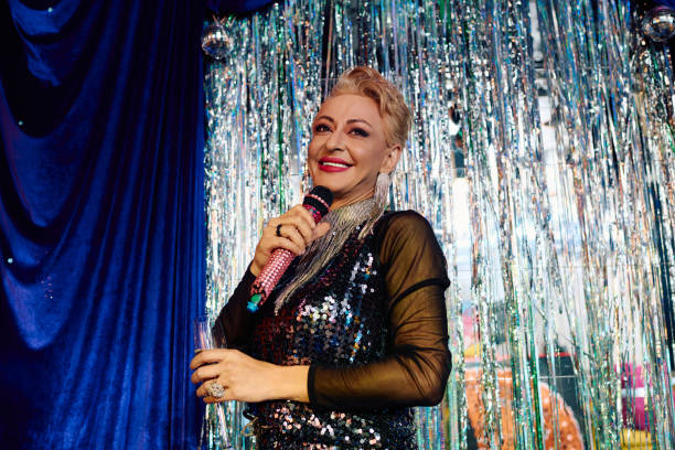 istock Bold drag queen captivates with extravagant performance at holiday gala stage 2187099649