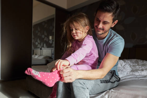 istock Beautiful family getting ready for skiing 2187100809
