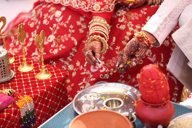 istock Offering prayers to the holy fire during a Hindu wedding ceremony. 2187101238