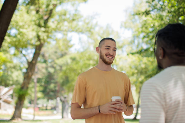 istock Friends talking in the park 2187101411