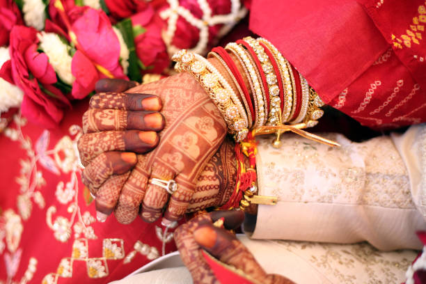 istock Groom holding hand in bride hand. 2187101934