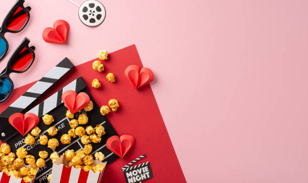 istock Romantic movie night setting with popcorn, 3D glasses, and heart decorations on a pink background, capturing the essence of Valentine's Day 2187102018