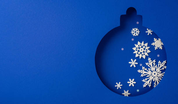 istock This image features a festive blue Christmas ornament cutout adorned with delicate white snowflakes, evoking a sense of winter wonder and holiday spirit 2187102078