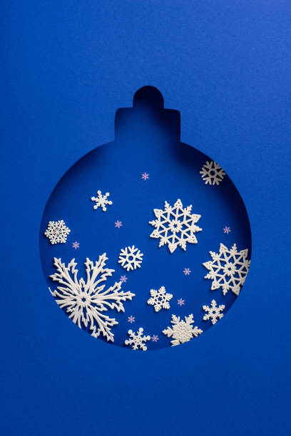 istock A vertical festive blue Christmas ornament cutout featuring delicate white snowflake patterns, capturing the essence of a winter wonderland and holiday creativity 2187102116