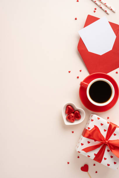 istock A top vertical view of a Valentine's day setup featuring coffee, a gift box, heart chocolates, a red envelope, and scattered hearts creating a romantic atmosphere 2187102136