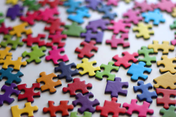 istock Colorful Jigsaw Puzzle Pieces 2187102694