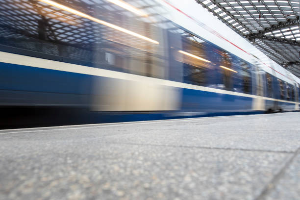 istock Train with motion blur leaving a railway station 2187102982