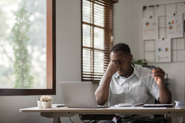 istock Stressed Male Office Worker Struggling with Deadlines and Workload in a Modern Office Environment 2187102983
