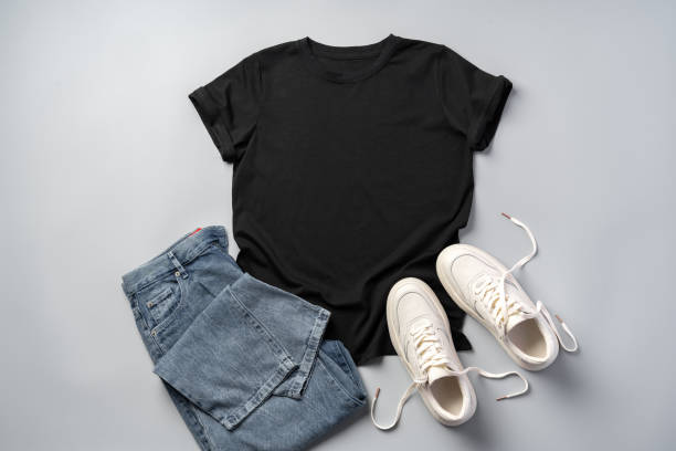 istock T-shirt, jeans and white sneakers on gray background top view 2187105221