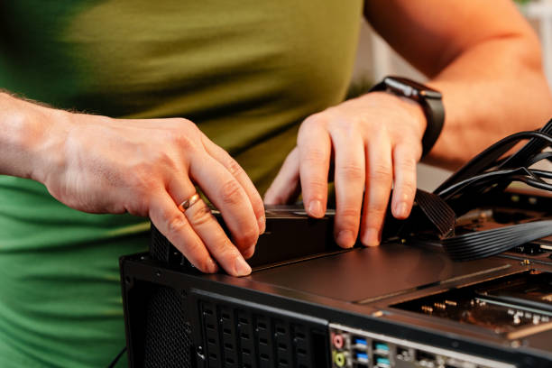 istock Close up of man repairing computer system unit 2187105233