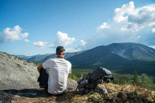 istock Young Man Enjoying Scenic Mountain View in Nature 2187105410