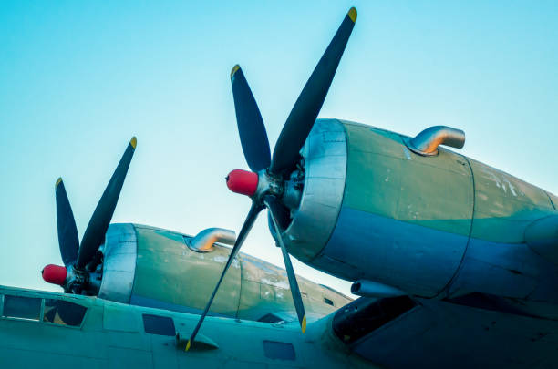 Low Angle View Of Propeller Airplane Against Black Background