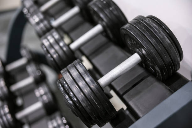 istock Close-up view of heavy dumbbells in a gym setting 2187111141