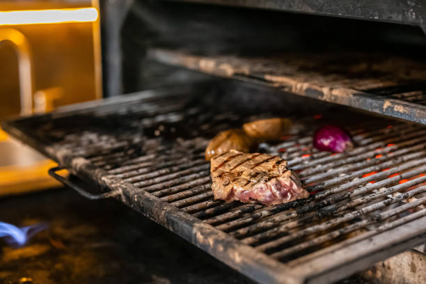 istock Juicy steak and vegetables being grilled on a barbecue 2187111375