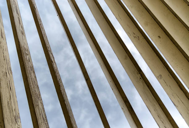 wooden planks on a background of sky and clouds abstract pattern