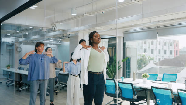 istock Corporate Employees Stretching for Workplace Health and Team Building 2187112126