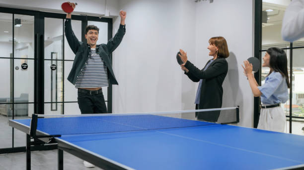 istock Hispanic latin man Celebrating a Table Tennis Victory in an Office 2187112193