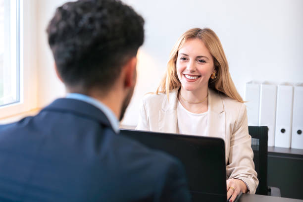 istock Professional business meeting between two colleagues in a bright office. 2187113513