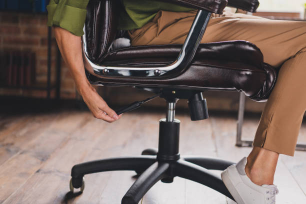 istock Photo of boss lady sit fix regulate chair workplace workstation loft interior indoors 2187115571