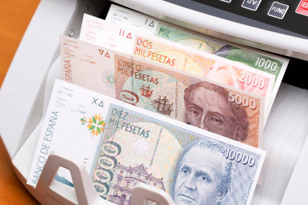 istock Spanish peseta in the counting machine 2187116582