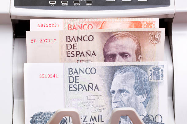 istock Spanish peseta in the counting machine 2187116617