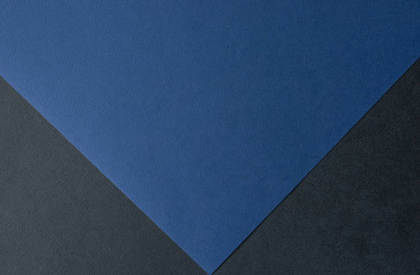 istock Dark blue and black colored paper
background texture, Two tones, Concept for image, text, design. Geometric paper backdrop. 2187118673