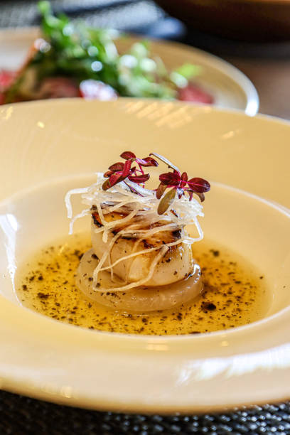 istock Seared scallop with microgreens and onion garnish 2187119120