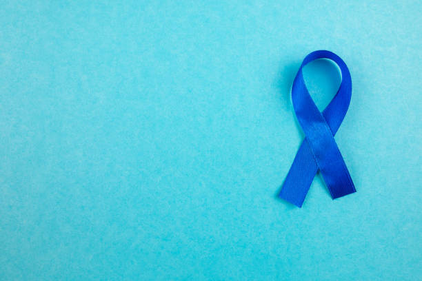 istock Blue awareness ribbon on light blue background, space for text 2187121194
