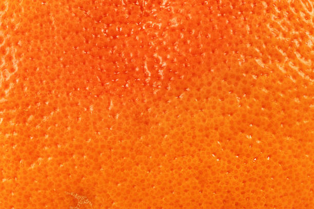 istock Citrus peel texture. Ripe orange or grapefruit background closeup. Macro shot 2187123422