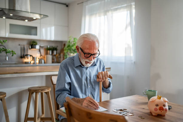 istock Senior man calculating his expenses 2187124803