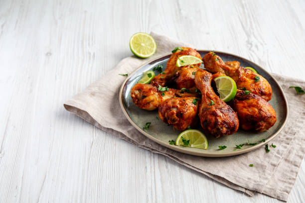 istock Homemade Grilled Jerk Chicken with Lime on a Plate, side view. Copy space. 2187125738