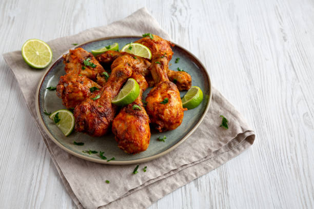istock Homemade Grilled Jerk Chicken with Lime on a Plate, side view. Copy space. 2187125746