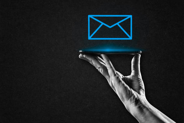 istock Hand Holding Smartphone with Email Sign 2187126044