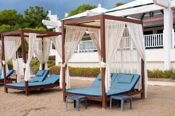 istock Relaxing beachside cabanas with elegant drapes near a resort in summer 2187126388