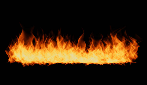 istock Flames on black background. Fire blaze flames on black background. Fire burn flame isolated, abstract texture. Flaming explosion effect with burning fire. 2187126551