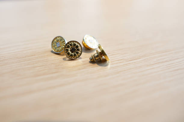 This phrase refers to the professional badges worn by four individuals who hold the qualification of Administrative Scrivener. In Japan, Administrative Scriveners (or Gyoseishoshi in Japanese) are licensed professionals who assist with legal documentation, administrative applications, and various official procedures. Their badge is a symbol of their authority and credibility in performing these tasks. The image or concept might be used in contexts such as legal representation, professional identity, or administrative services.