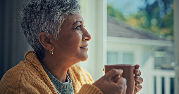 istock Elderly women drinking coffee by the window. 2187134988