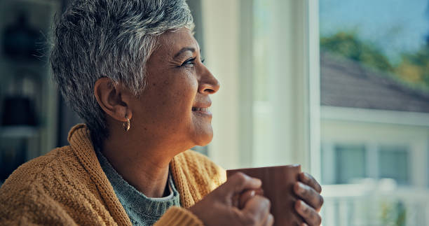 istock Elderly women drinking coffee by the window. 2187134991