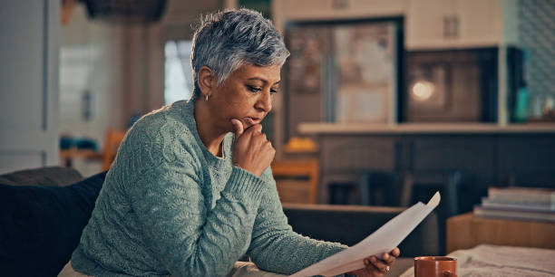 istock Concerned puzzled old retired woman using laptop 2187135159