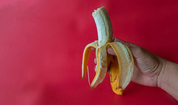 istock Bananas and plantains on a red background 2187136871
