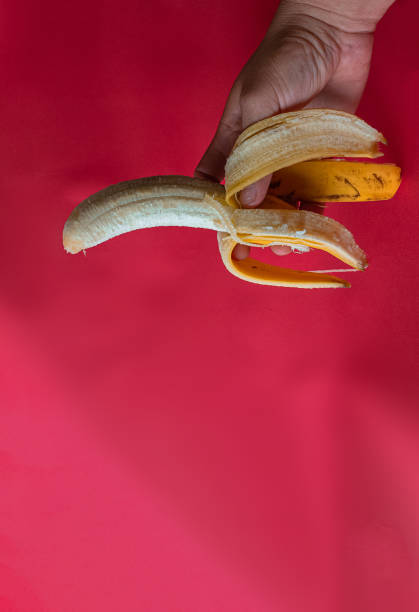 istock Bananas and plantains on a red background 2187136887