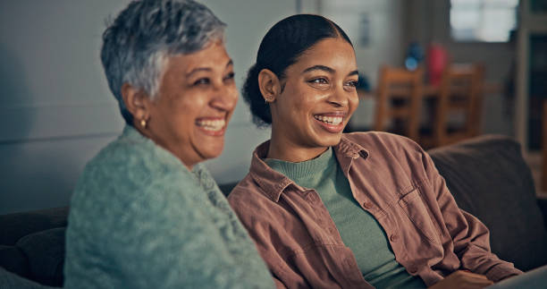 istock Mother and daughter watching tv. 2187137588