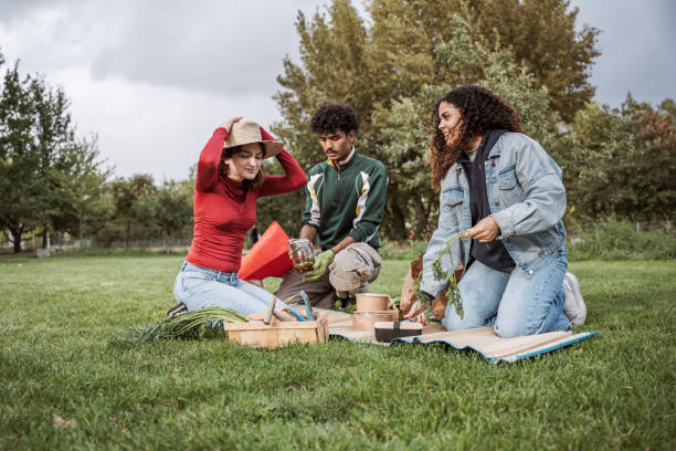 istock three young people having picnic in the park 2187140208