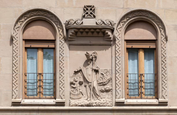 istock Beautifully carved stone relief above windows in historic building 2187142486