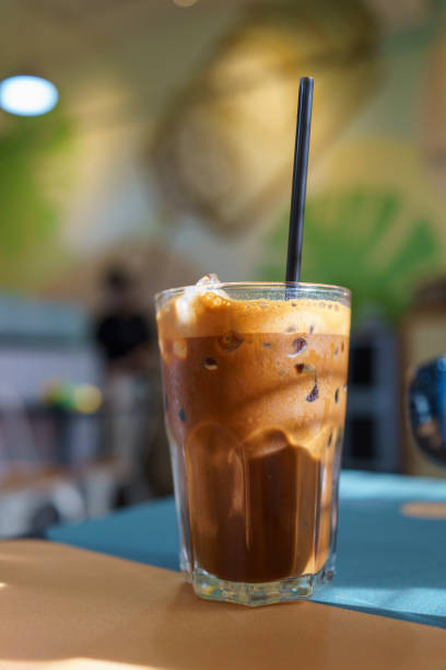 Iced Coffee in a Glass with a Black Straw
