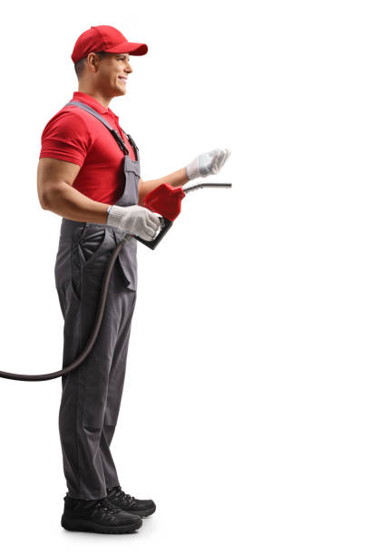 istock Gas station worker holding a refuel gun and talking 2187143195